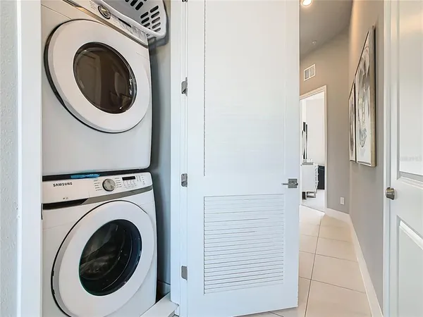 an aerial view of residential houses with outdoor space and ocean view