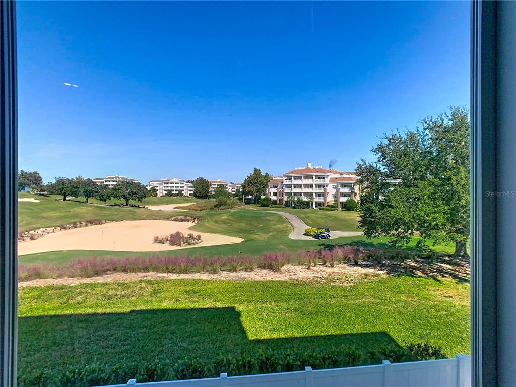 7740 Sandy Ridge Drive, Unit 245 Reunion, FL 34747 - Photo 53 of 57 a view of a lake with a big yard