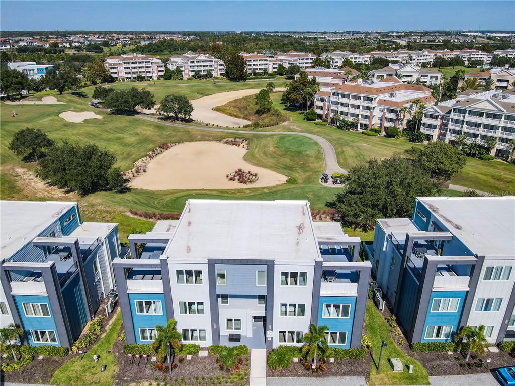 7740 Sandy Ridge Drive, Unit 245 Reunion, FL 34747 - Photo 56 of 57 an aerial view of residential houses with outdoor space and ocean view