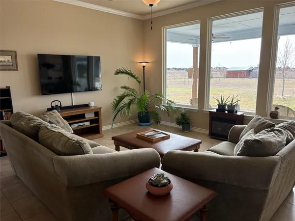 a living room with furniture and a flat screen tv