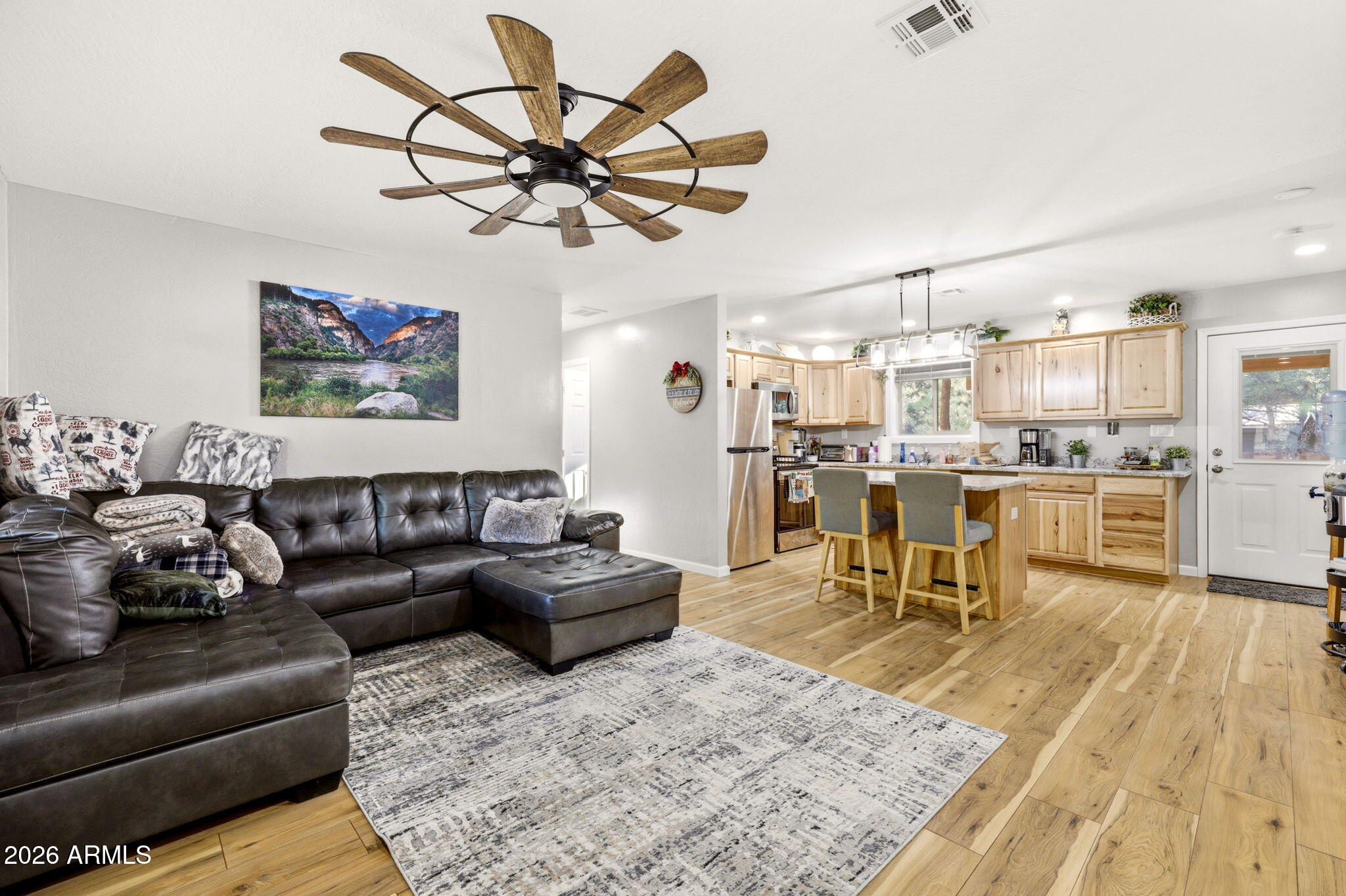 2900 Long Rifle Place Overgaard, AZ 85933 - Photo 8 of 35 a living room with furniture and kitchen view