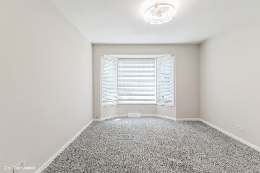 207 Walker Drive Bolingbrook, IL 60440 - Photo 13 of 18 a view of an empty room with a window