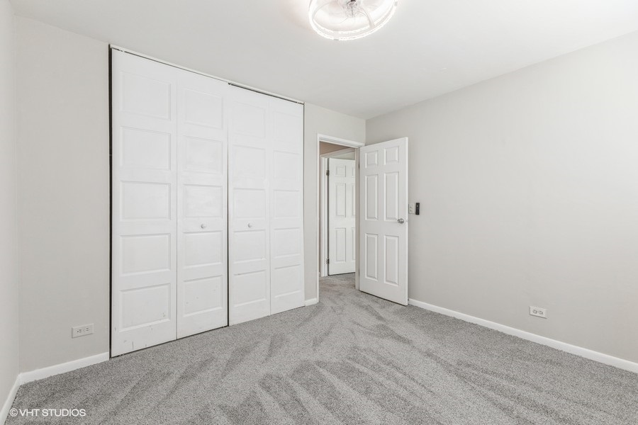 207 Walker Drive Bolingbrook, IL 60440 - Photo 15 of 18 an empty room with closet