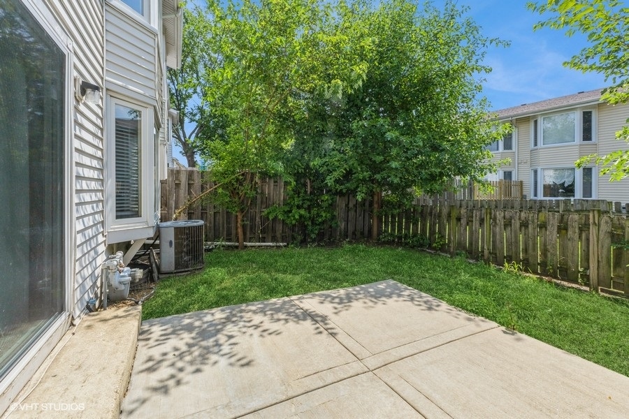 207 Walker Drive Bolingbrook, IL 60440 - Photo 18 of 18 a view of a house with a back yard