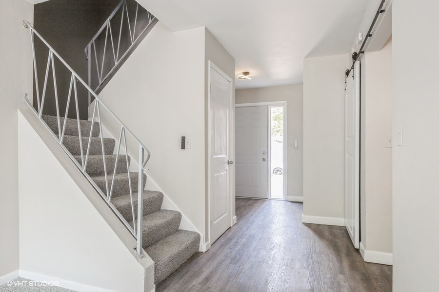 207 Walker Drive Bolingbrook, IL 60440 - Photo 2 of 18 a view of an entryway with wooden floor