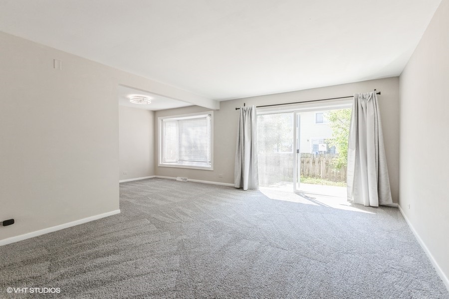 207 Walker Drive Bolingbrook, IL 60440 - Photo 7 of 18 a view of an empty room with a window