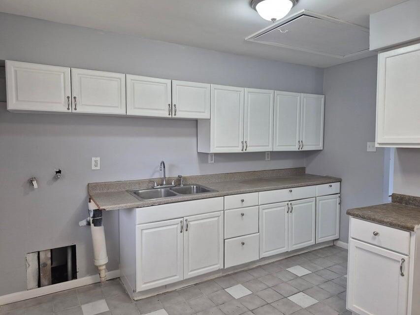 3326 Delaware Street Gary, IN 46409 - Photo 2 of 14 a kitchen with granite countertop white cabinets and a sink