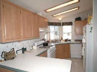 2963 Santa Rosa Avenue, Unit B5 Santa Rosa, CA 95407 - Photo 3 of 6 a kitchen with sink a window and cabinets
