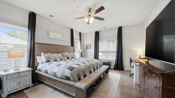 a view of a dining room with furniture window and wooden floor
