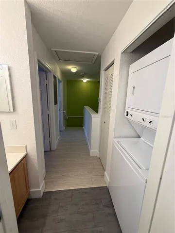 a view of a hallway with washer and dryer