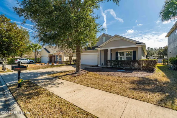 an aerial view of a house with swimming pool