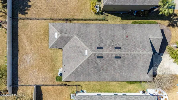 a view of a house with backyard porch and sitting area