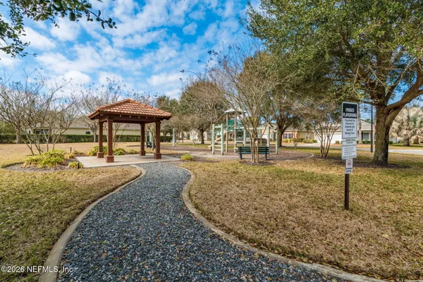 a view of a park with swings and slides