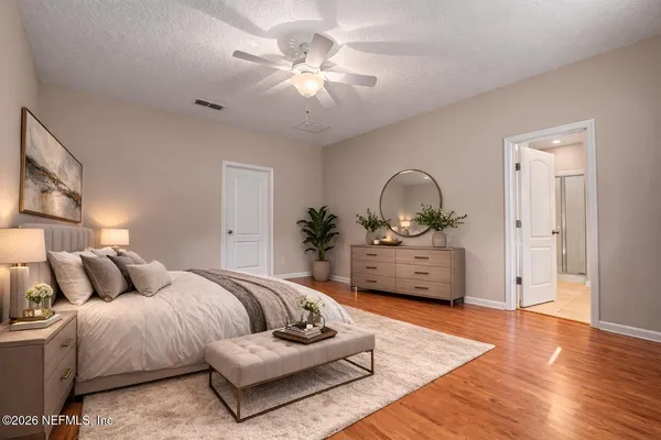 a living room with furniture a couch and a chandelier