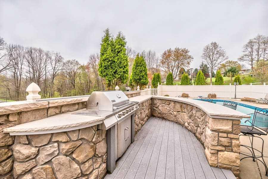 340 Whitestown Road Harmony, PA 16037 - Photo 6 of 25 Exterior Back. Pool Area with Stone Entertaining Bar and Grill