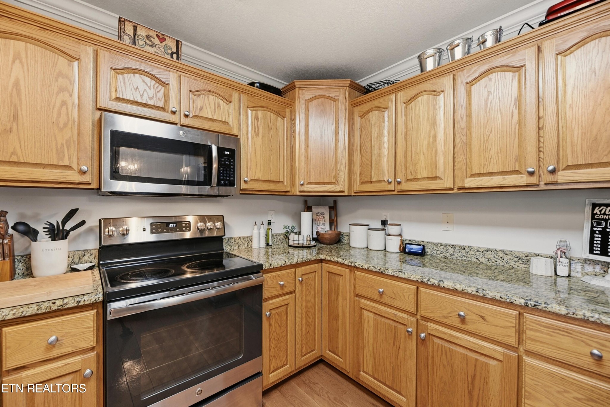 117 Elizabethton Way Clinton, TN 37716 - Photo 15 of 41 a kitchen with stainless steel appliances granite countertop a stove microwave and cabinets