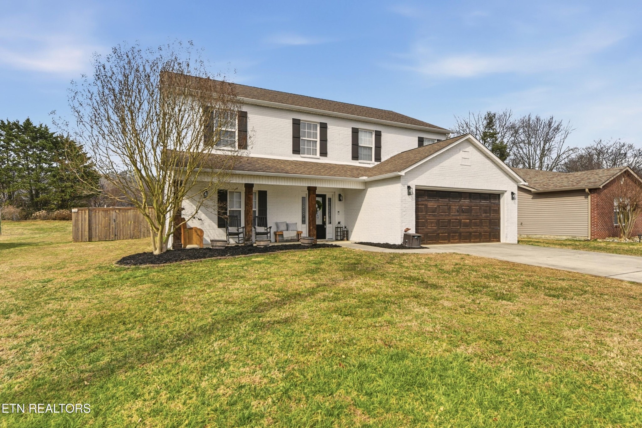 117 Elizabethton Way Clinton, TN 37716 - Photo 2 of 41 a front view of a house with a garden