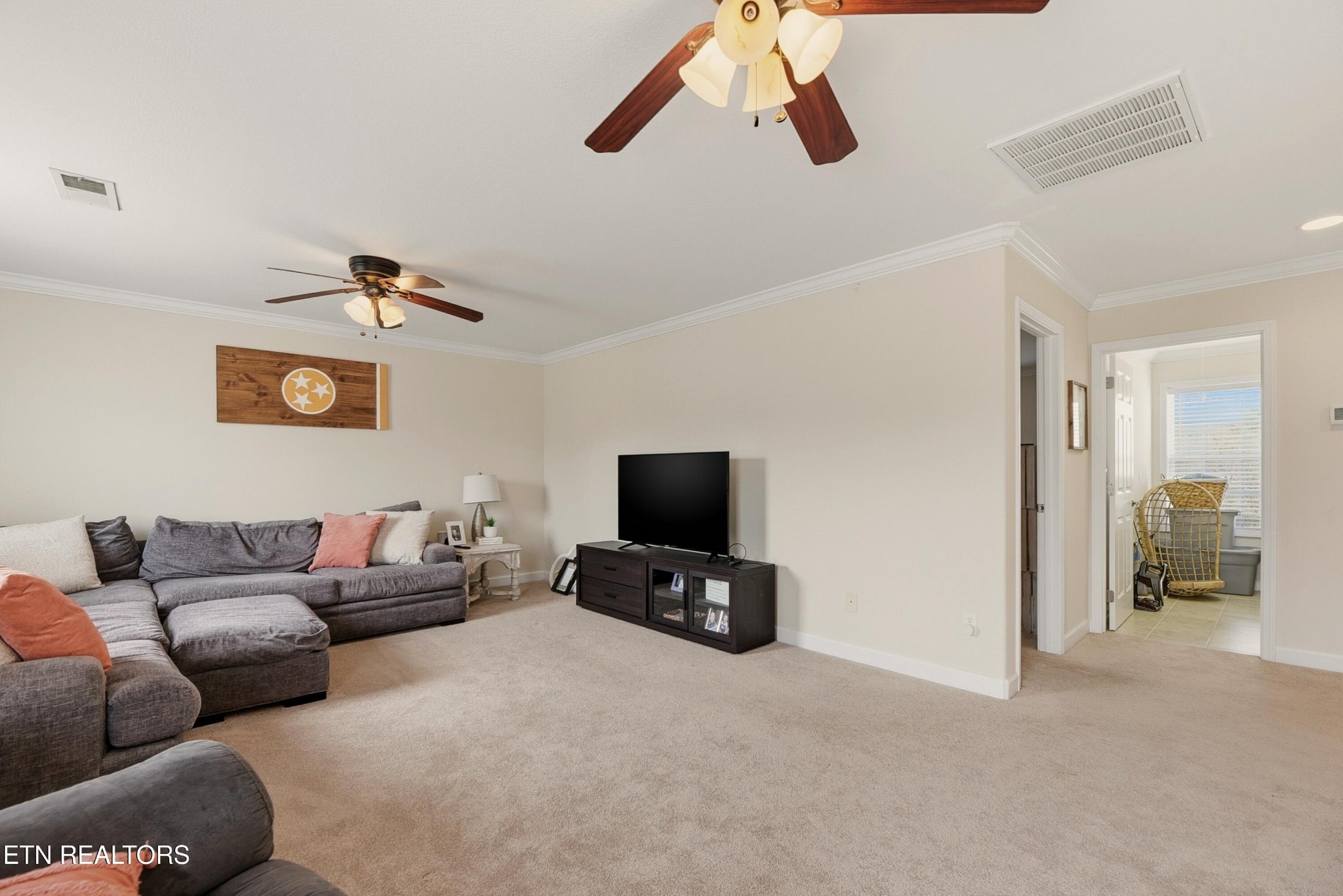 117 Elizabethton Way Clinton, TN 37716 - Photo 24 of 41 a living room with furniture and a flat screen tv