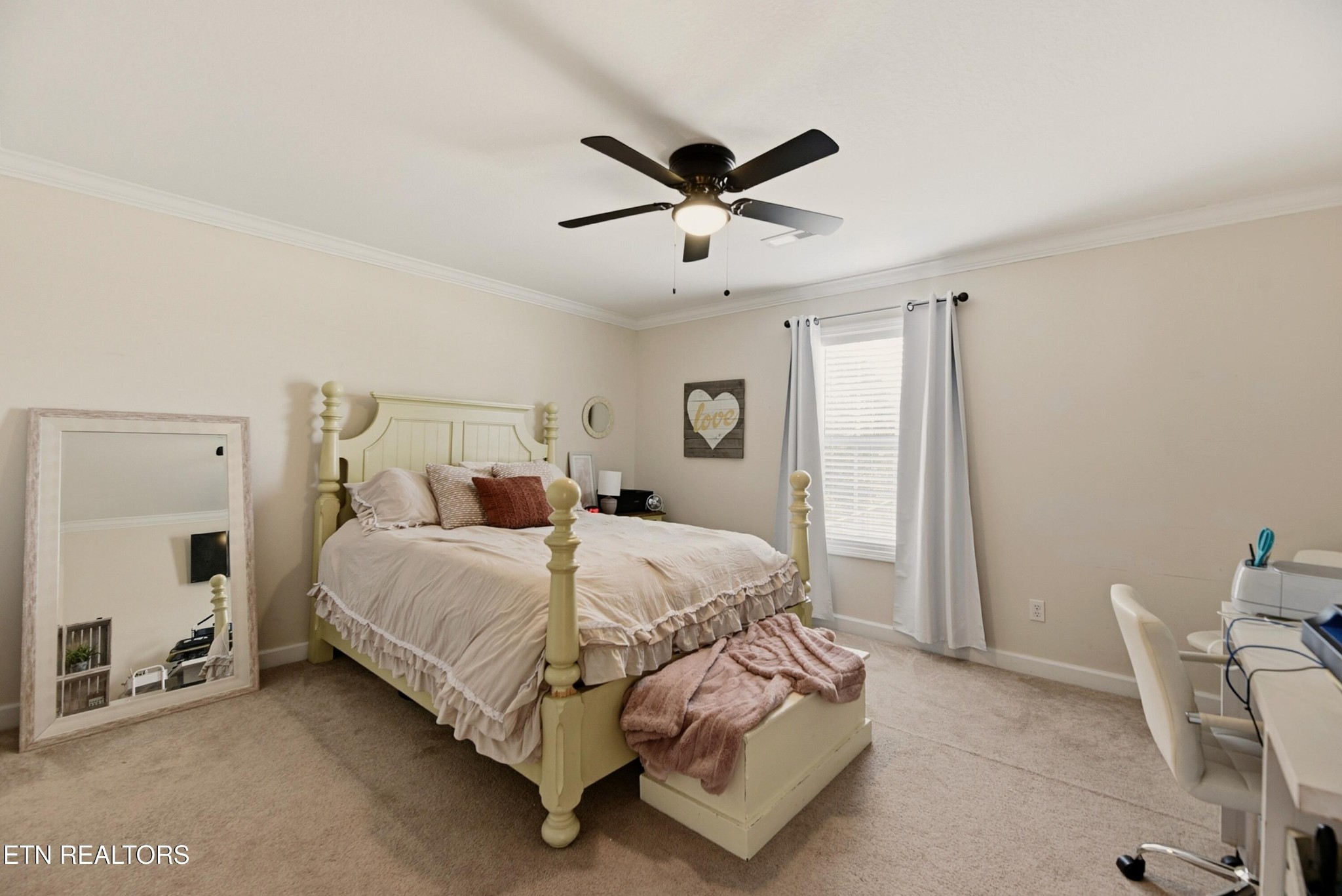 117 Elizabethton Way Clinton, TN 37716 - Photo 28 of 41 a bedroom with a bed and a chandelier