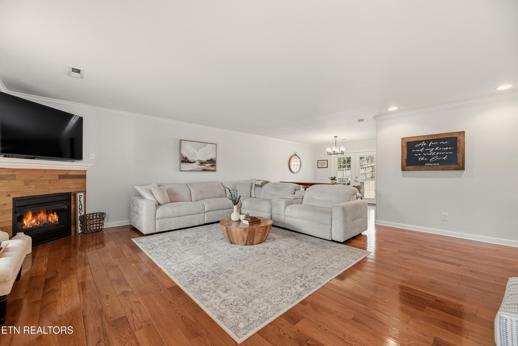 117 Elizabethton Way Clinton, TN 37716 - Photo 5 of 41 a living room with furniture a fireplace and a flat screen tv