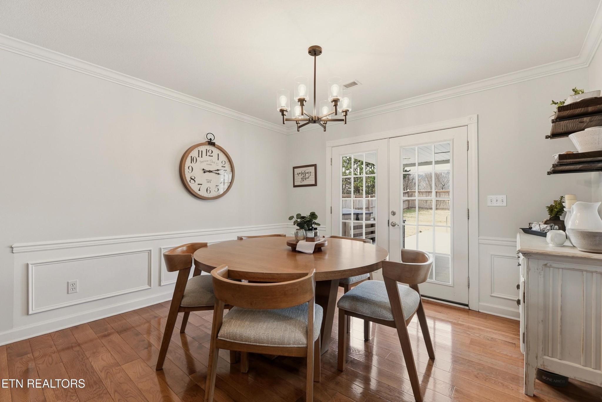 117 Elizabethton Way Clinton, TN 37716 - Photo 9 of 41 a view of a dining room with furniture a chandelier and wooden floor