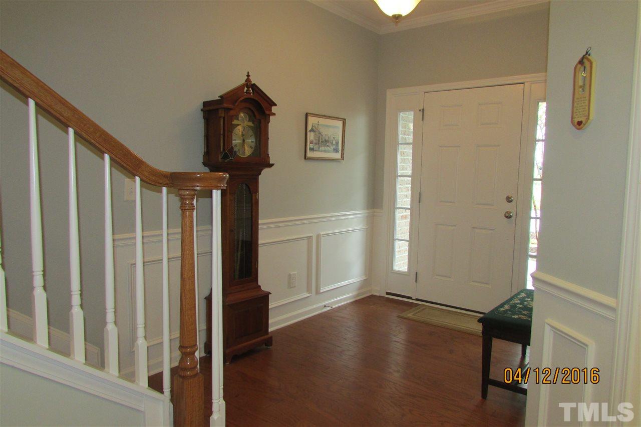 9134 Wooden Road Raleigh, NC 27617 - Photo 4 of 25 Hardwoods in foyer. View from stairs