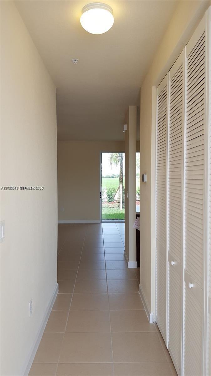 142 Northeast 28th Terrace, Unit 7 Homestead, FL 33033 - Photo 11 of 17 a view of hallway with bathroom
