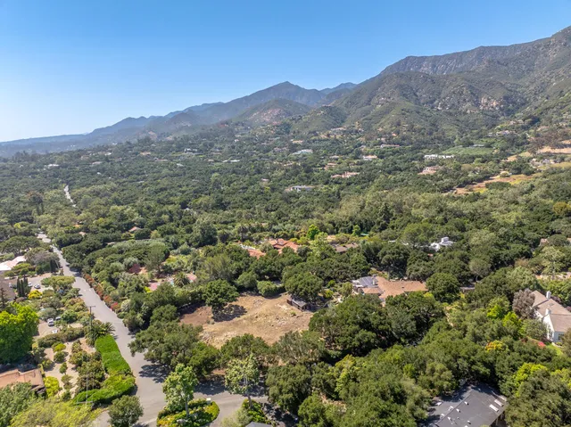 an aerial view of residential house and green space