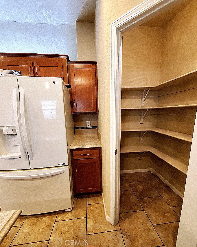 21621 Sandia Road, Unit 127 Apple Valley, CA 92308 - Photo 11 of 43 a view of walk in closet with empty racks