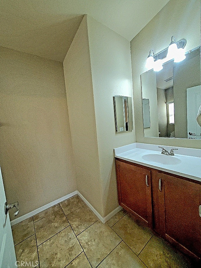 21621 Sandia Road, Unit 127 Apple Valley, CA 92308 - Photo 20 of 43 a bathroom with a sink and a mirror