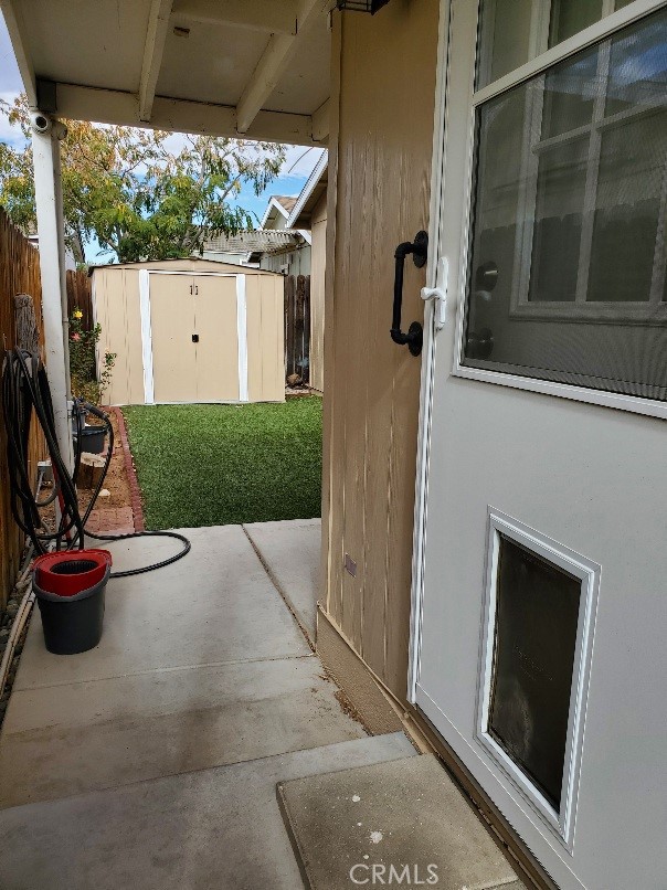 21621 Sandia Road, Unit 127 Apple Valley, CA 92308 - Photo 21 of 43 a view of a patio with a table and chairs and potted plants