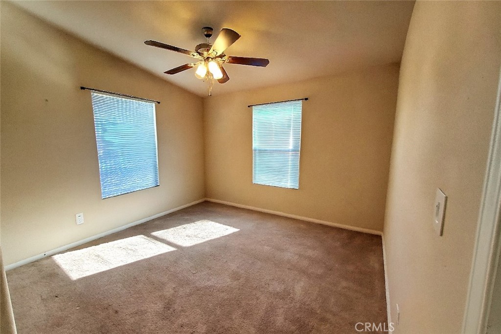 21621 Sandia Road, Unit 127 Apple Valley, CA 92308 - Photo 24 of 43 a view of an empty room with a window