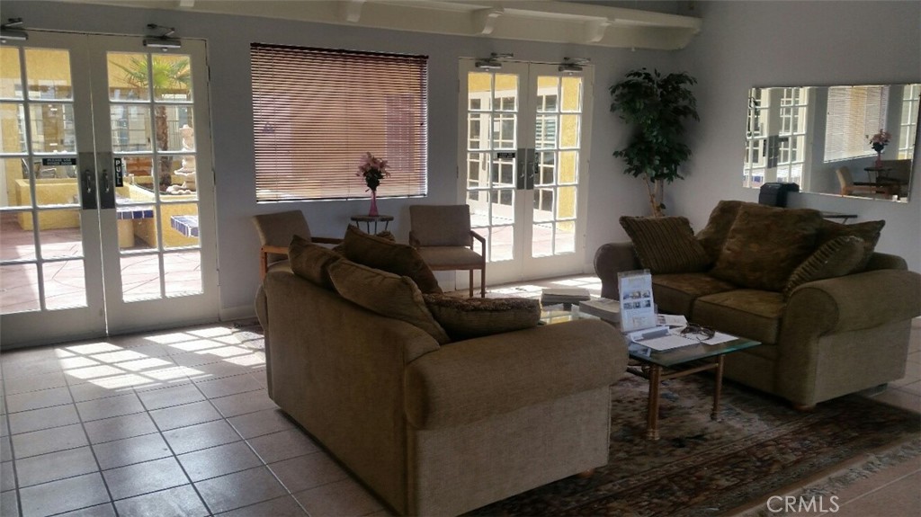 21621 Sandia Road, Unit 127 Apple Valley, CA 92308 - Photo 34 of 43 a living room with furniture and a large window
