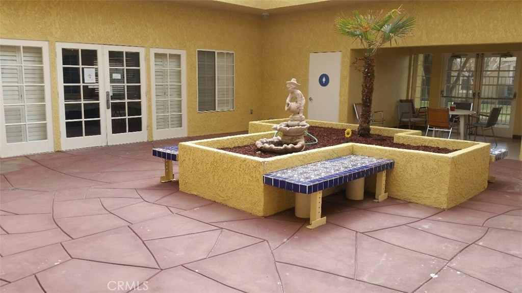 21621 Sandia Road, Unit 127 Apple Valley, CA 92308 - Photo 38 of 43 a living room with a couch and a table