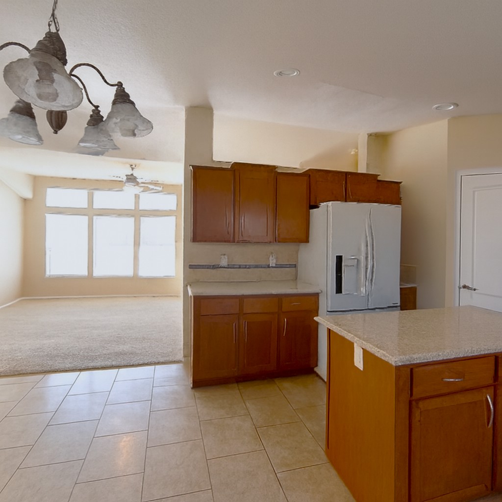 21621 Sandia Road, Unit 127 Apple Valley, CA 92308 - Photo 9 of 43 a kitchen with stainless steel appliances granite countertop a sink and a refrigerator