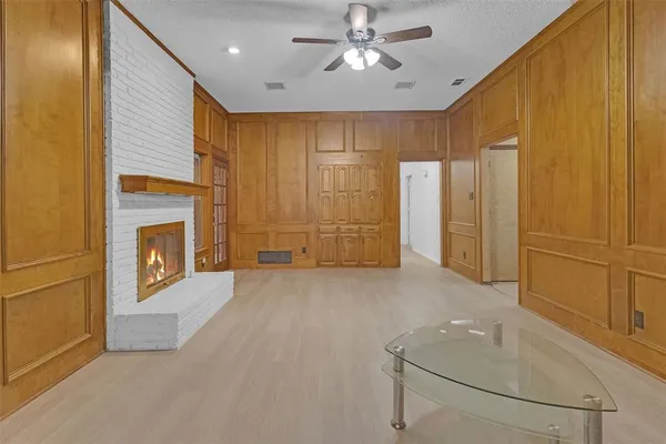 a view of an empty room with a fireplace