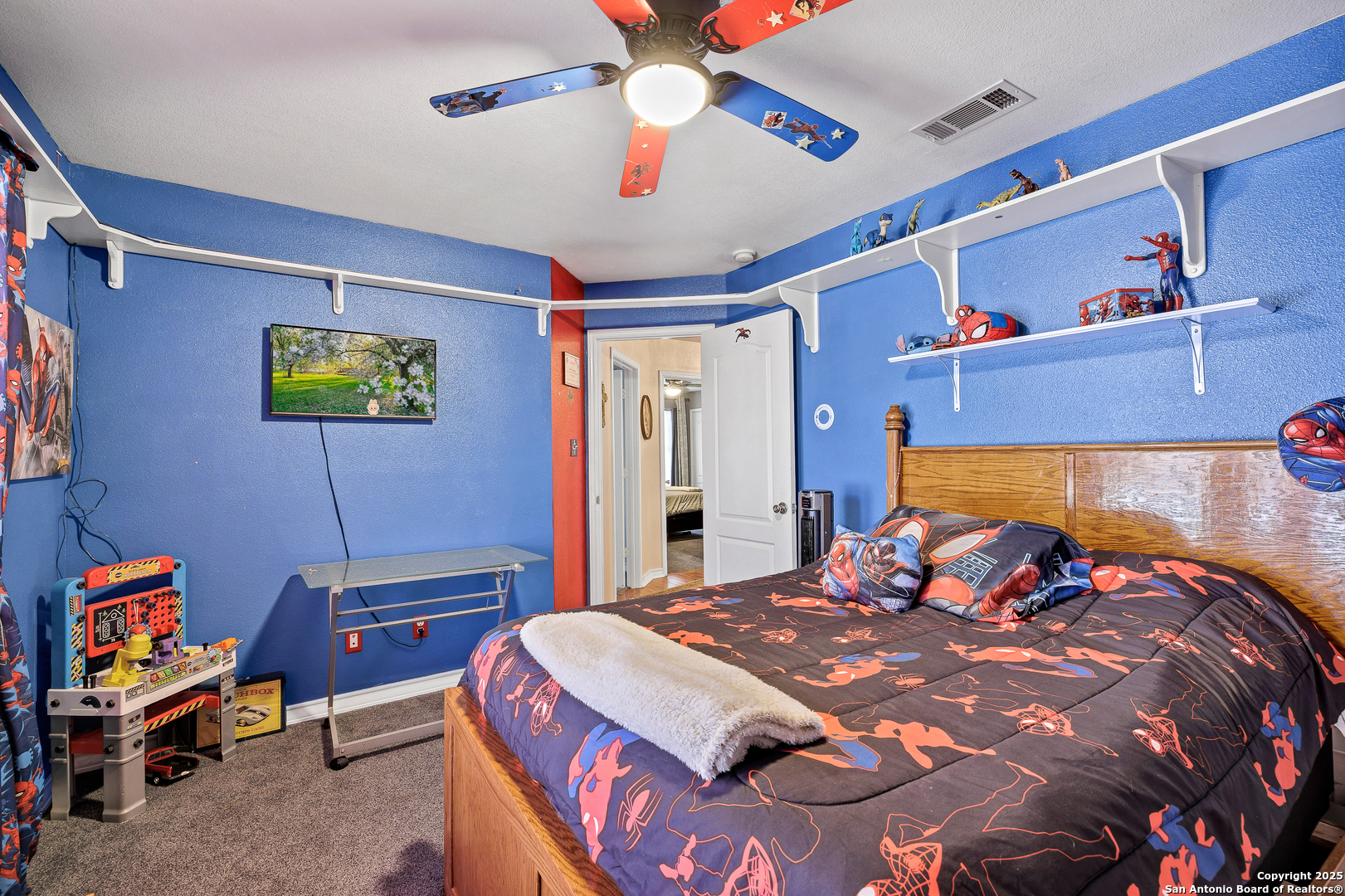 1611 Springhouse Street San Antonio, TX 78251 - Photo 21 of 30 a bedroom with a bed and a chandelier