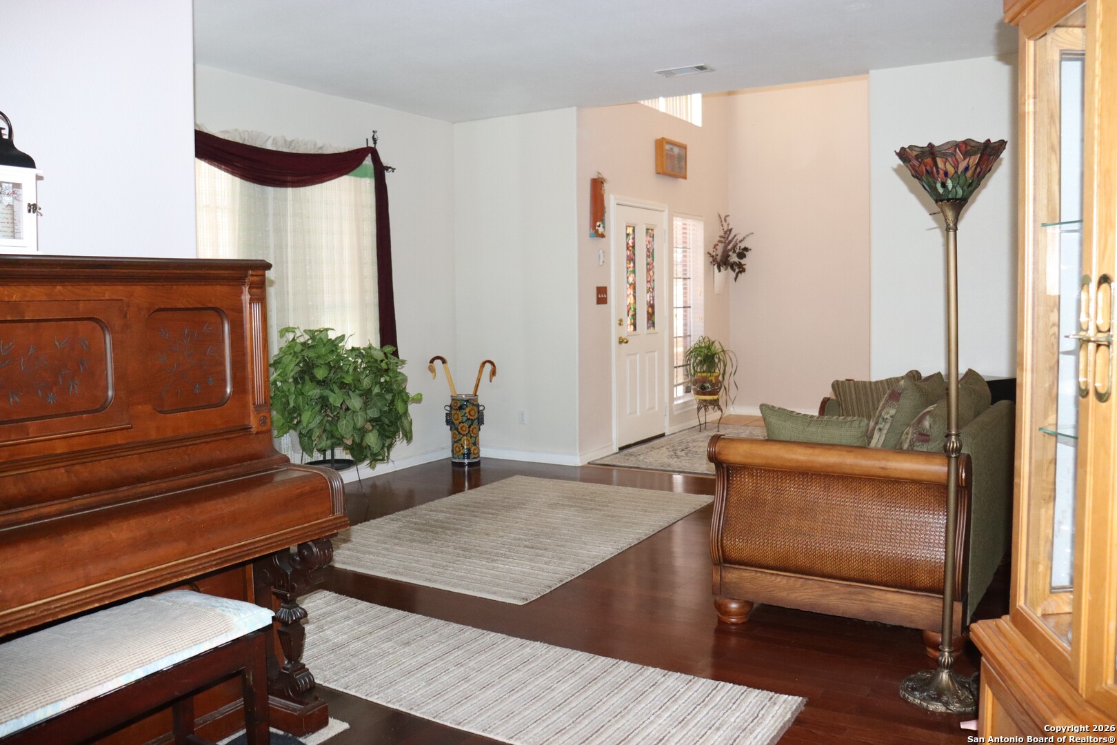 1611 Springhouse Street San Antonio, TX 78251 - Photo 7 of 30 a living room with furniture and a potted plant
