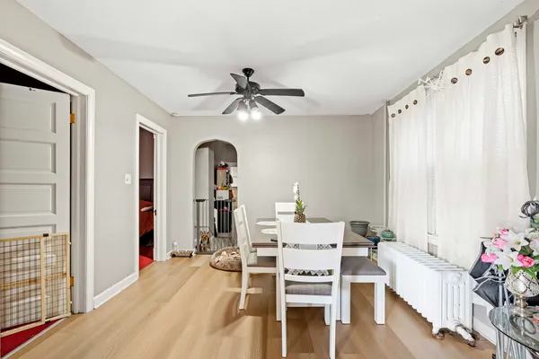 a living room with furniture and flowers