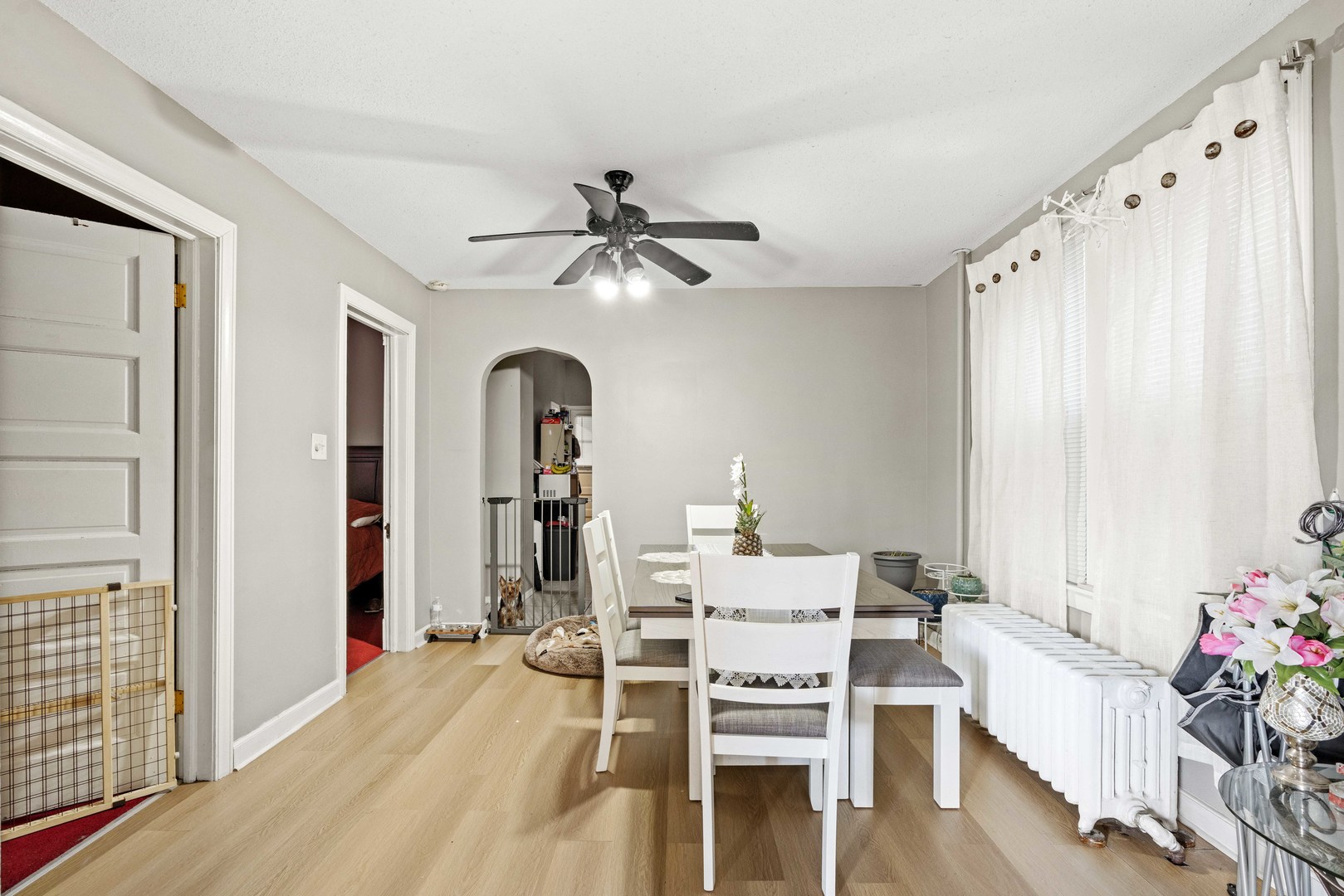 2922 East 97th Street Chicago, IL 60617 - Photo 13 of 20 a living room with furniture and flowers