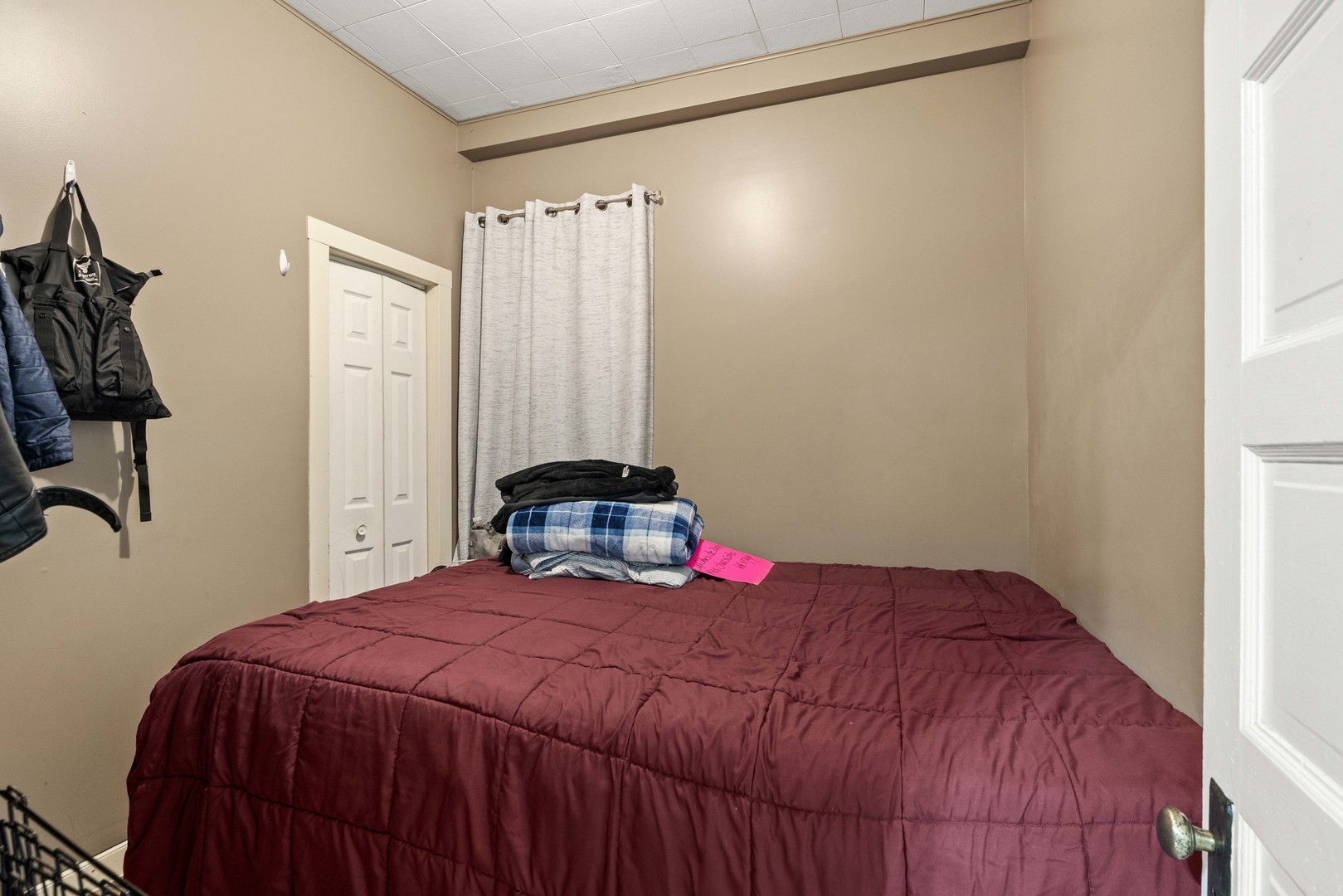 2922 East 97th Street Chicago, IL 60617 - Photo 18 of 20 a bedroom with a bed and a mirror