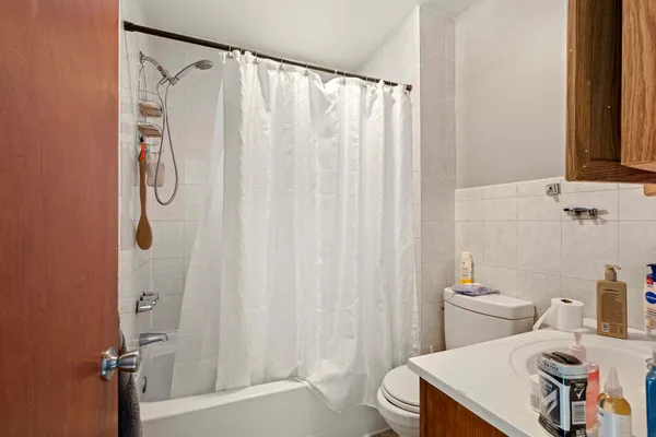 a bathroom with a sink and a shower curtain