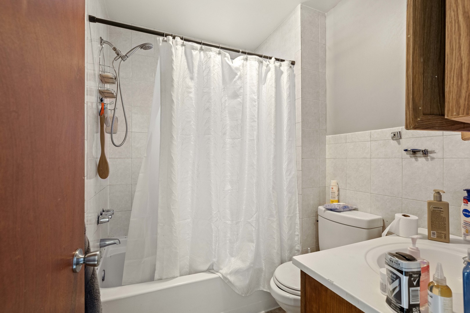 2922 East 97th Street Chicago, IL 60617 - Photo 20 of 20 a bathroom with a sink and a shower curtain