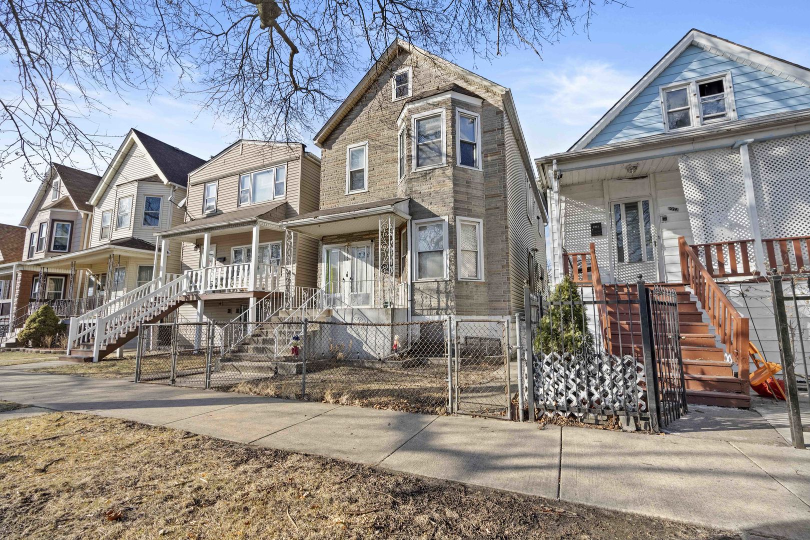 2922 East 97th Street Chicago, IL 60617 - Photo 2 of 20 a front view of a house with garden