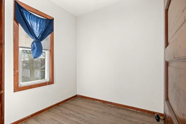 a view of front door and wooden floor