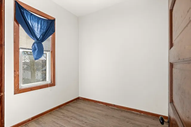 a view of front door and wooden floor