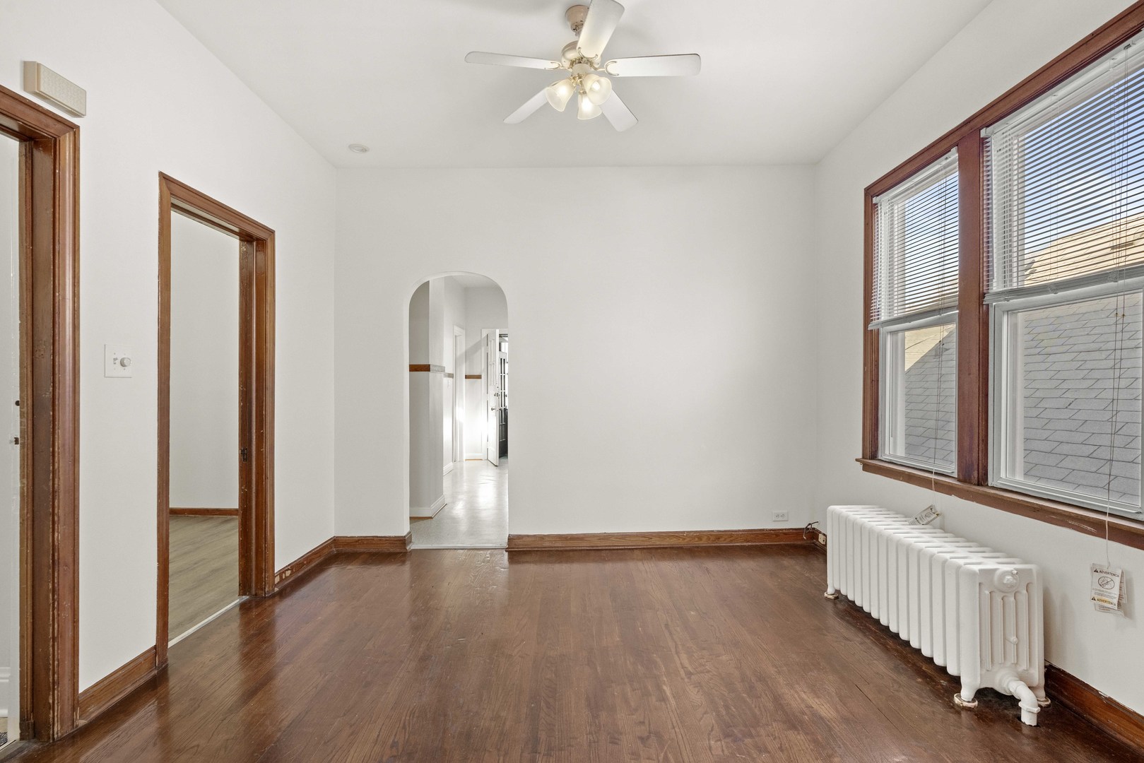 2922 East 97th Street Chicago, IL 60617 - Photo 5 of 20 wooden floor in an empty room with a window