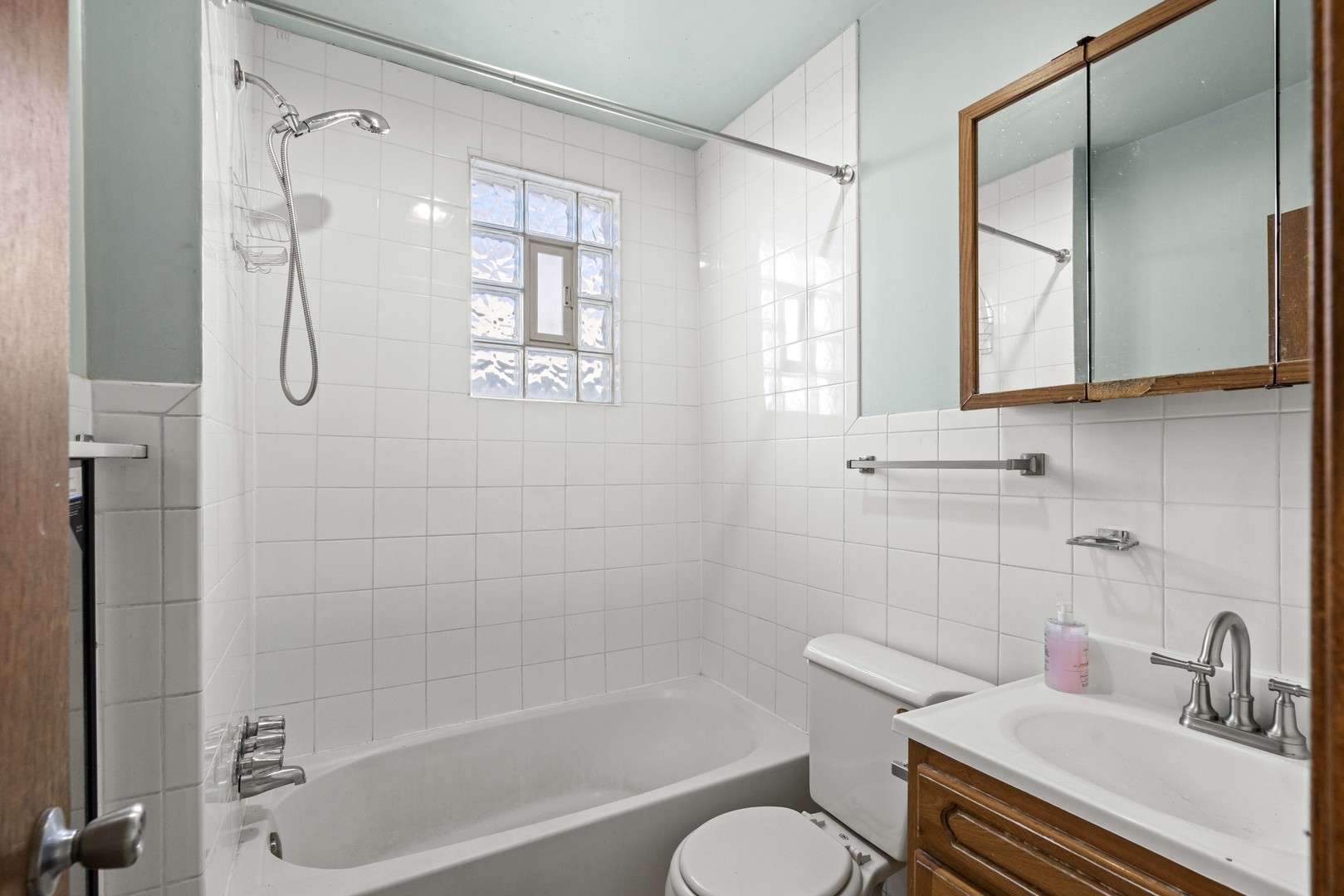 2922 East 97th Street Chicago, IL 60617 - Photo 8 of 20 a bathroom with a sink toilet and shower