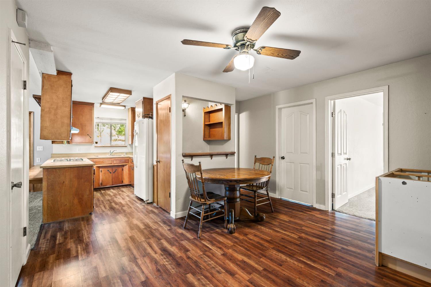 2860 Jim Valley Road Placerville, CA 95667 - Photo 13 of 34 a view of a dining room with furniture and wooden floor