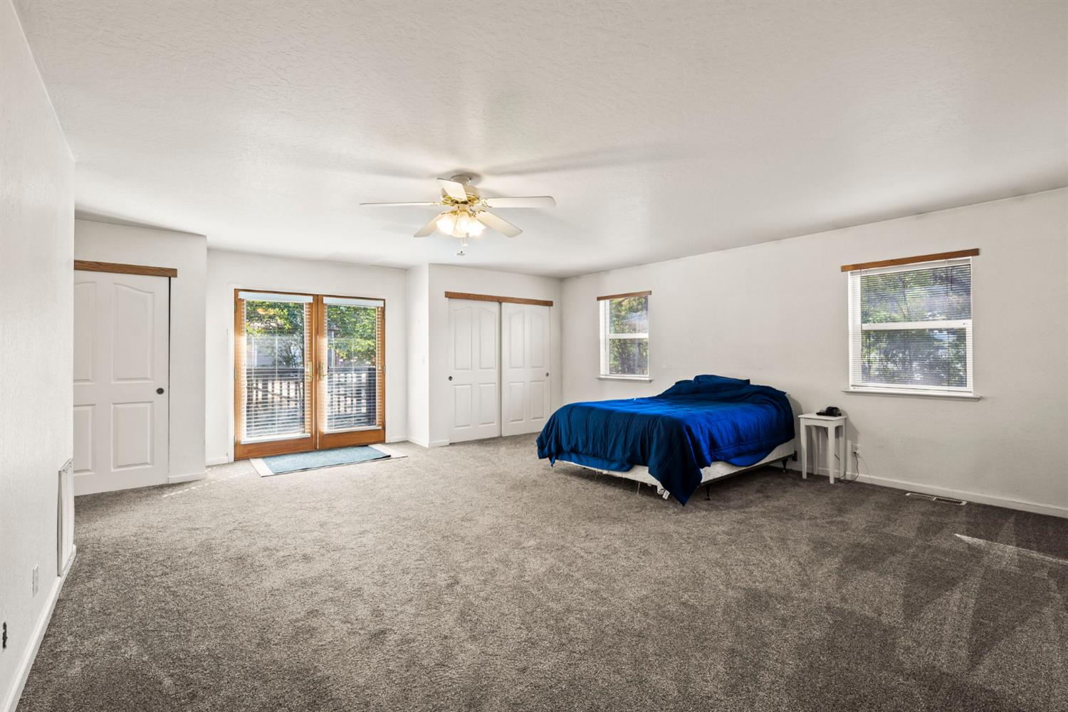 2860 Jim Valley Road Placerville, CA 95667 - Photo 17 of 34 a view of an empty room with window and chandelier fan